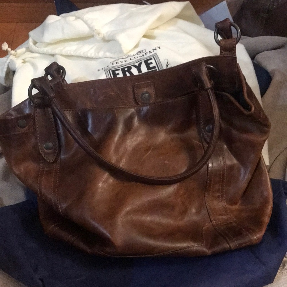 Frye company hand bag comes with duster bag